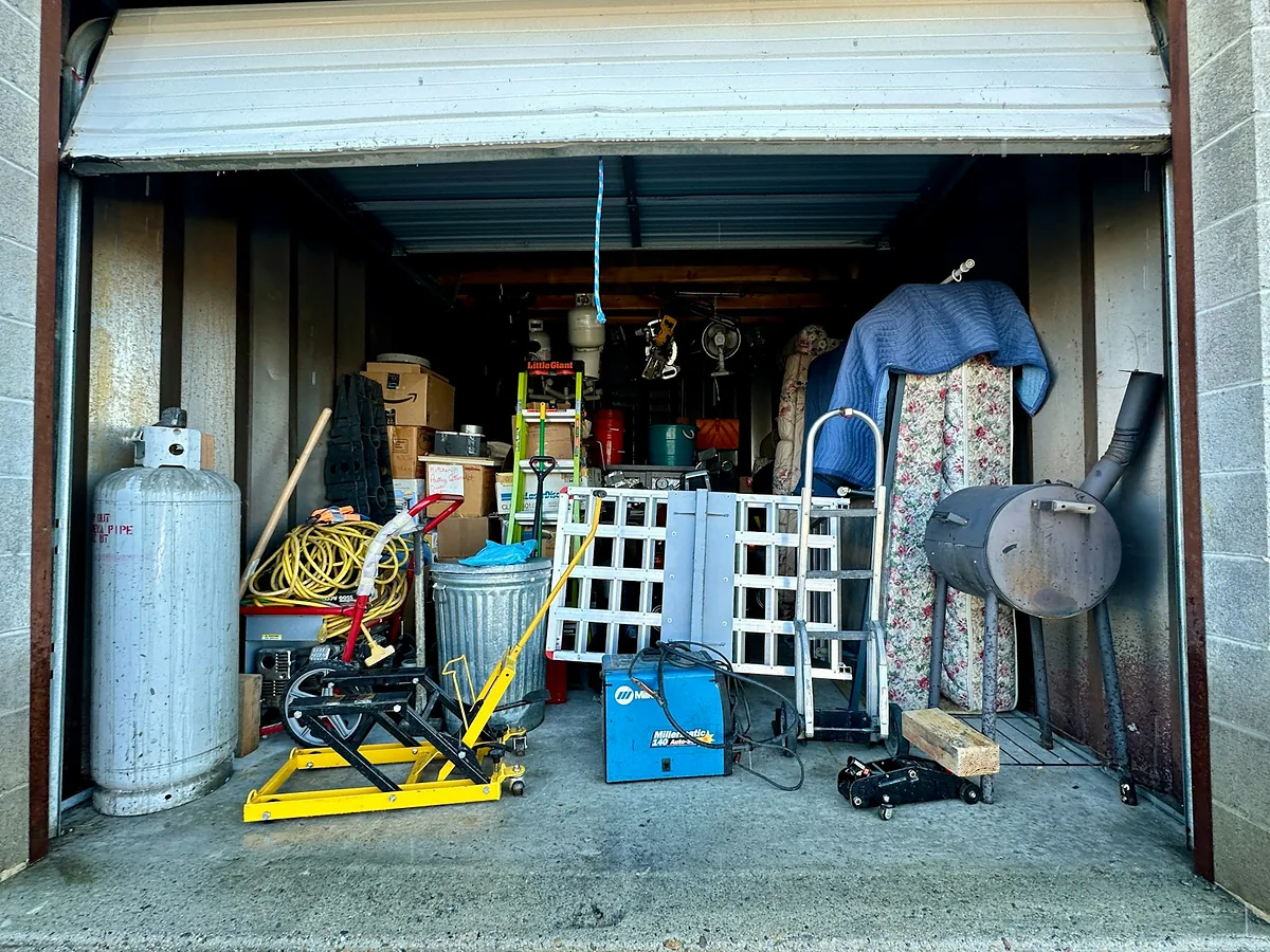 Cluttered garage ready for a junk removal cleanout
